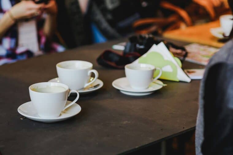 kaboompics_White cups of coffee on a table