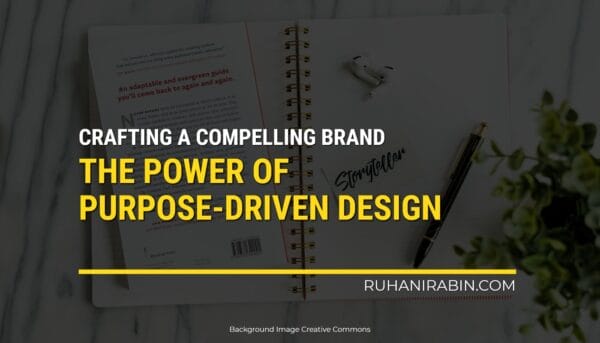 A notebook, a cup of coffee, and a small plant are sitting on a gray wooden table. The word "Storyteller" is written on the notebook. There is also some text on the image that says "Crafting a Compelling Brand - The Power of Purpose-Driven Design" and "Ruhanirabin.com.