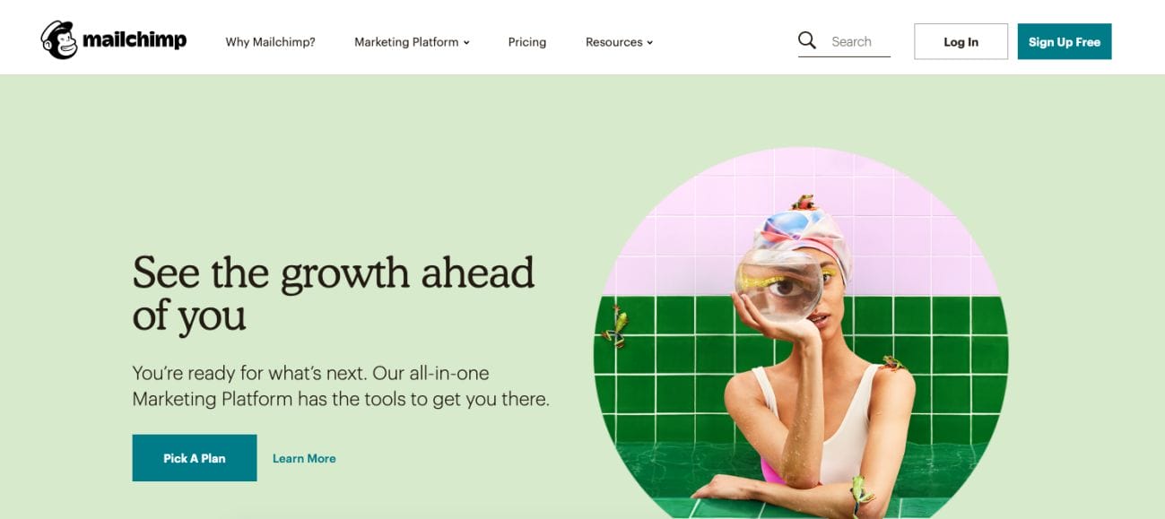 A Mailchimp webpage shows a woman relaxing in a bathtub with a tropical drink and wearing a towel on her head. The text says, "See the growth ahead of you," emphasizing Mailchimp's digital marketing tools. There are buttons for finding a plan and signing up, encouraging you to explore their complete marketing services.