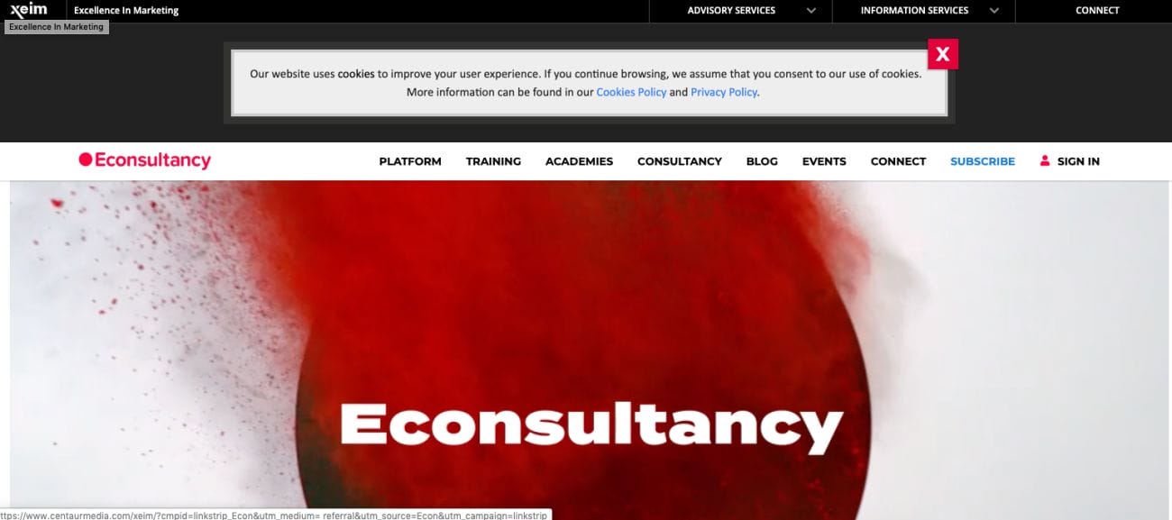 The homepage of the Econsultancy website has a vibrant red background design. At the top, there's a banner about cookie consent that allows you to adjust your settings. The menu includes options like Platform, Training, Academies, Consultancy, and others, showcasing a wide range of digital marketing resources.